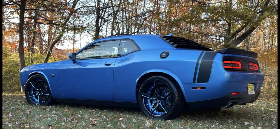 Rear three-quarter view of Challenger with custom wheels